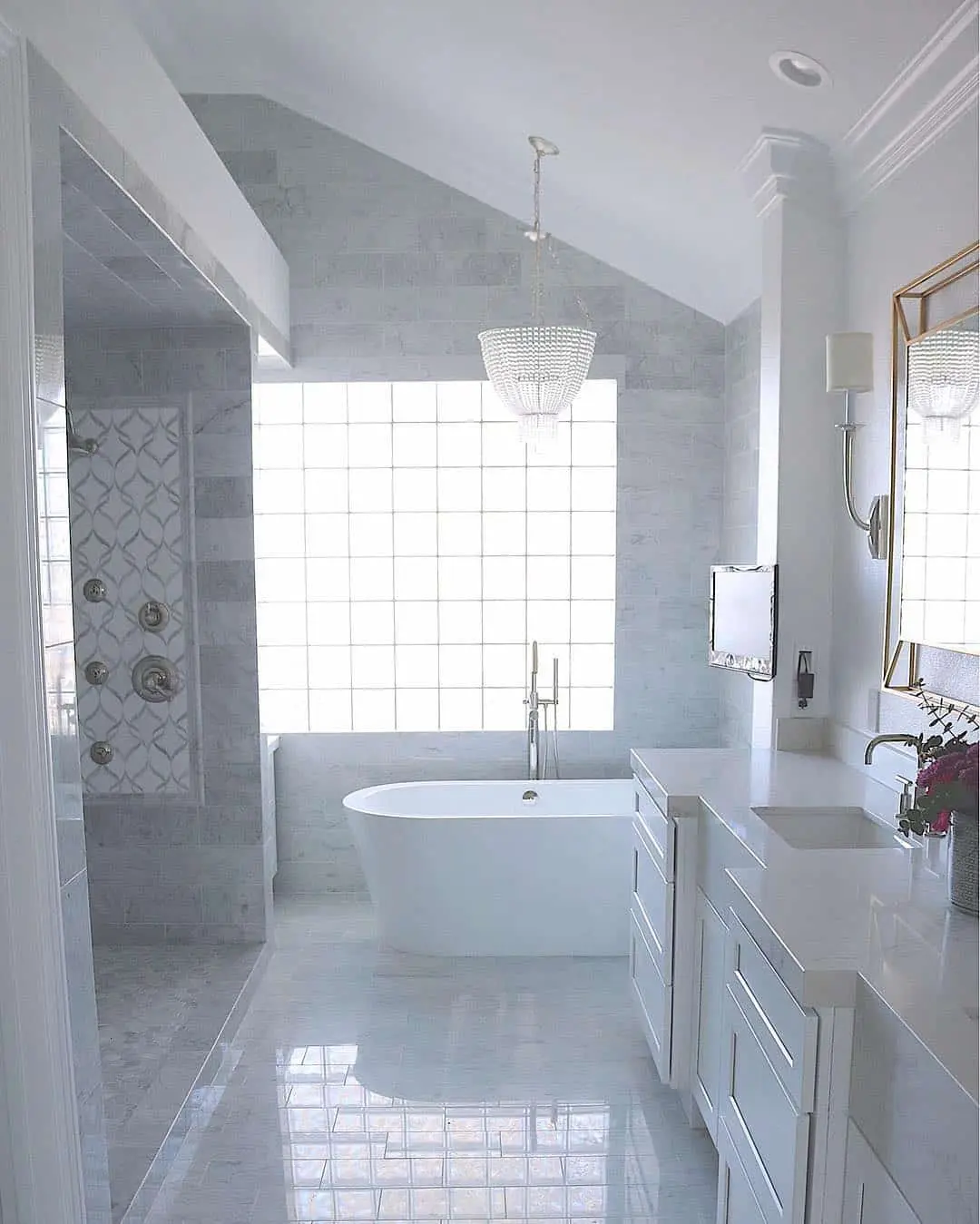 Crystal Chandelier Adds Glamour Above a Freestanding Tub