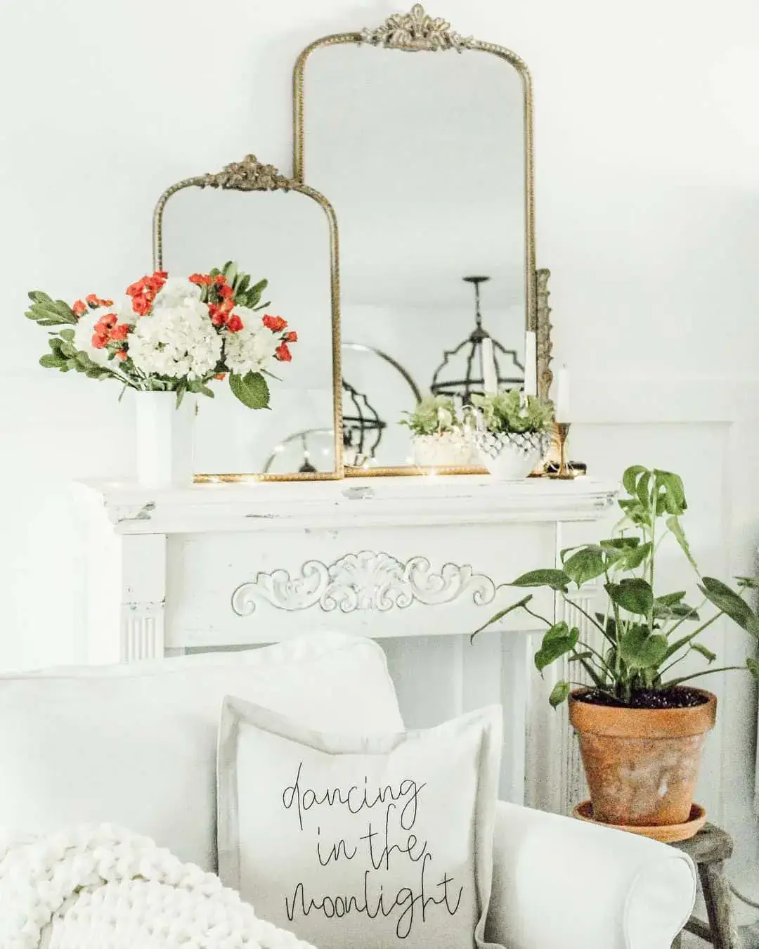 Ornate Arched Mirrors Frame a Fireplace Mantel Display