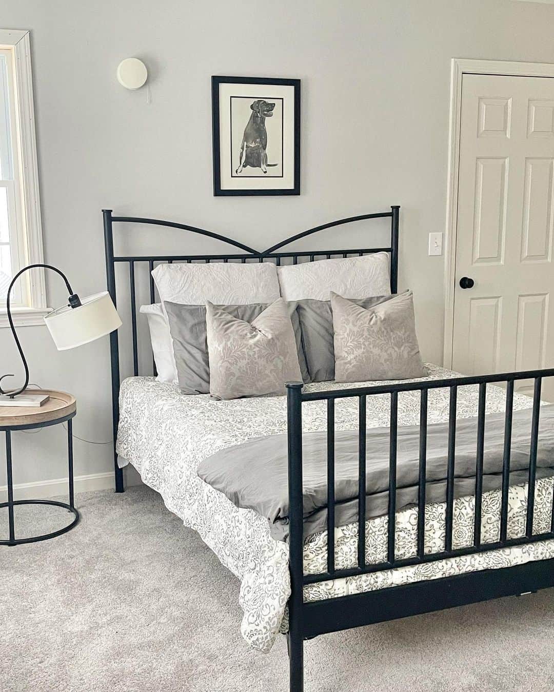 Framed Dog Portrait Adds a Personal Touch Above the Bed