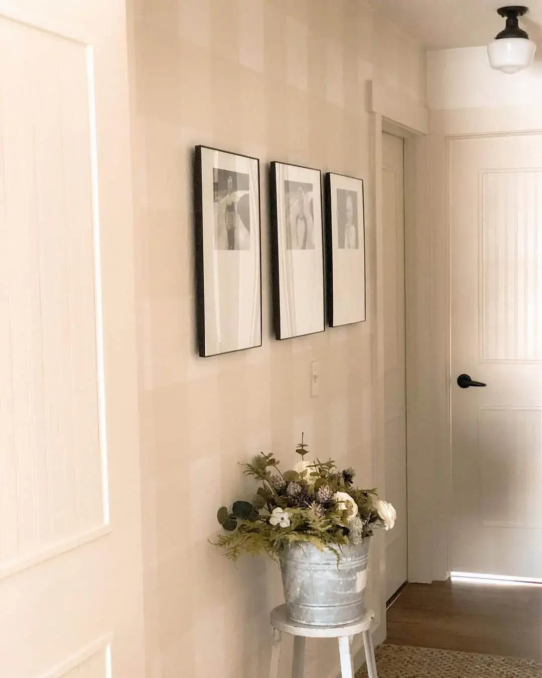 Design a Vertical Gallery with Three Tall Black Frames