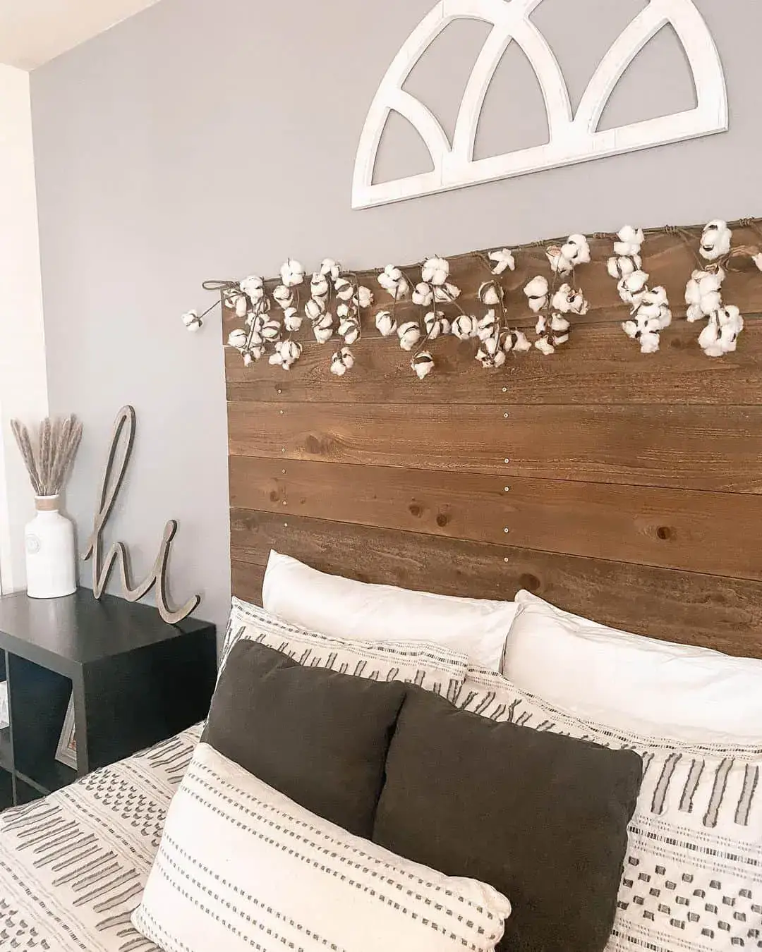 Rustic Wood Headboard Adorned With a Cotton Stalk Garland