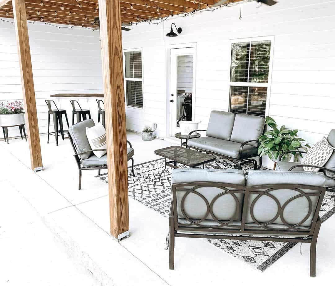 Layer Black and White Geometric Rugs to Define Seating