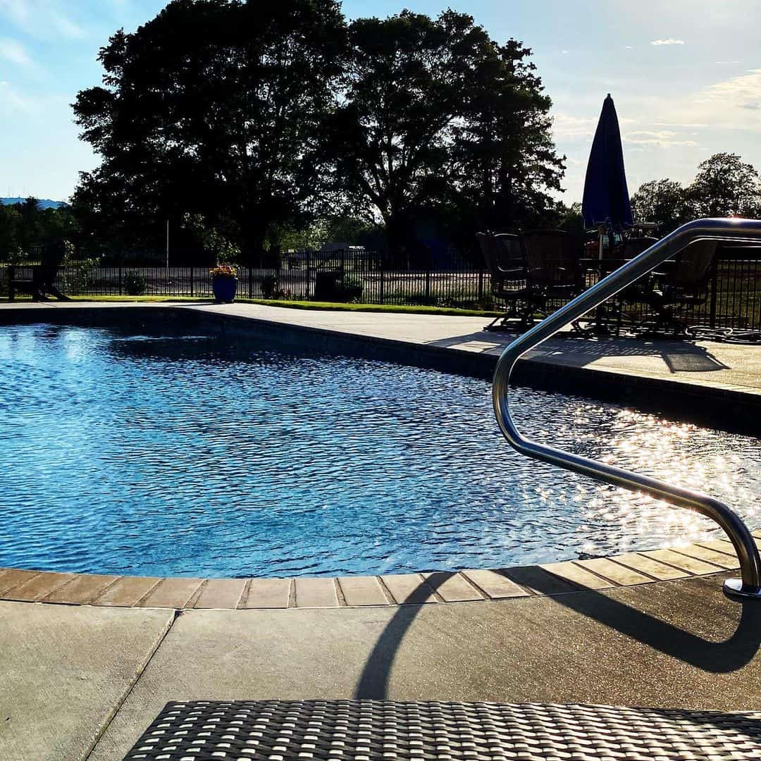 Curved Metal Handrail Adds A Sleek Entry Point