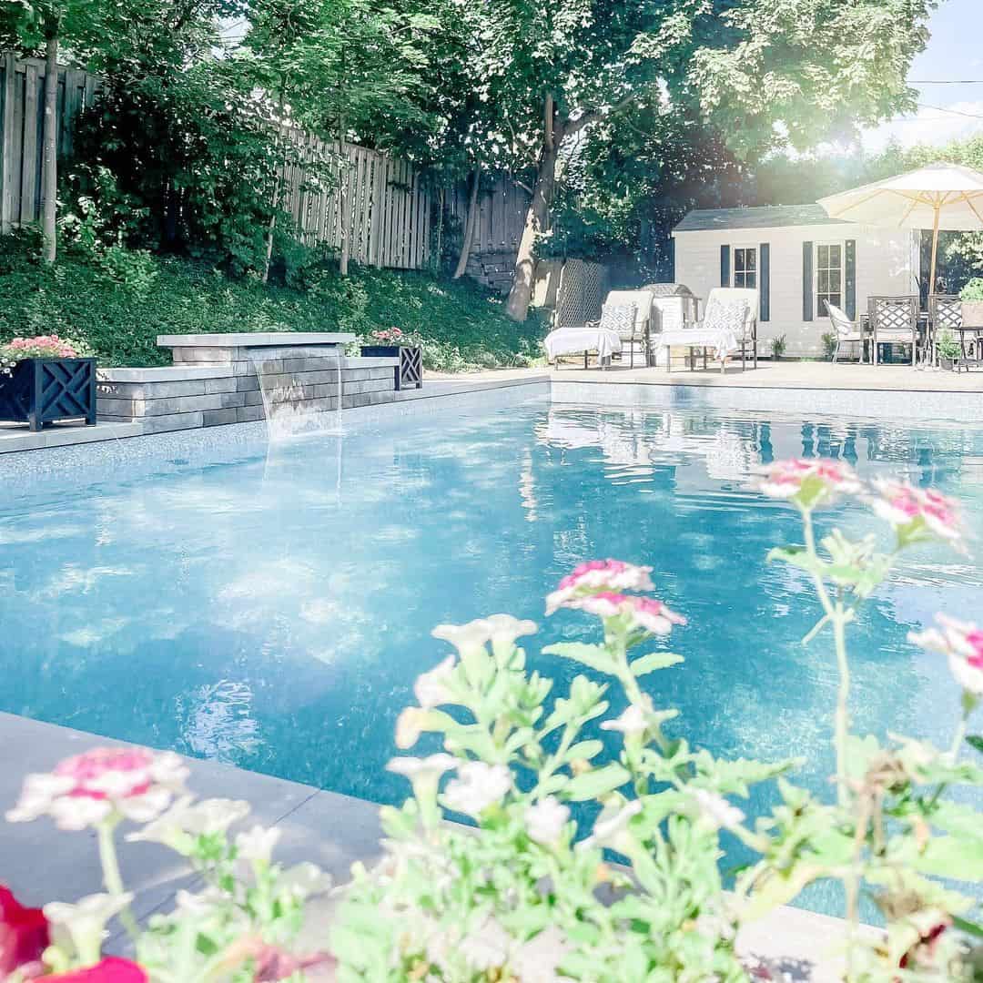 Tiered Stone Wall Adds A Waterfall Feature To Your Pool
