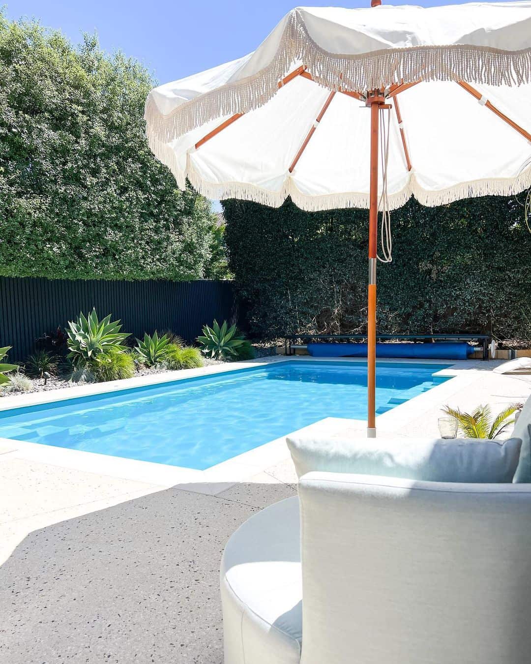 Fringed Patio Umbrella Adds Boho Flair to Poolside Lounging