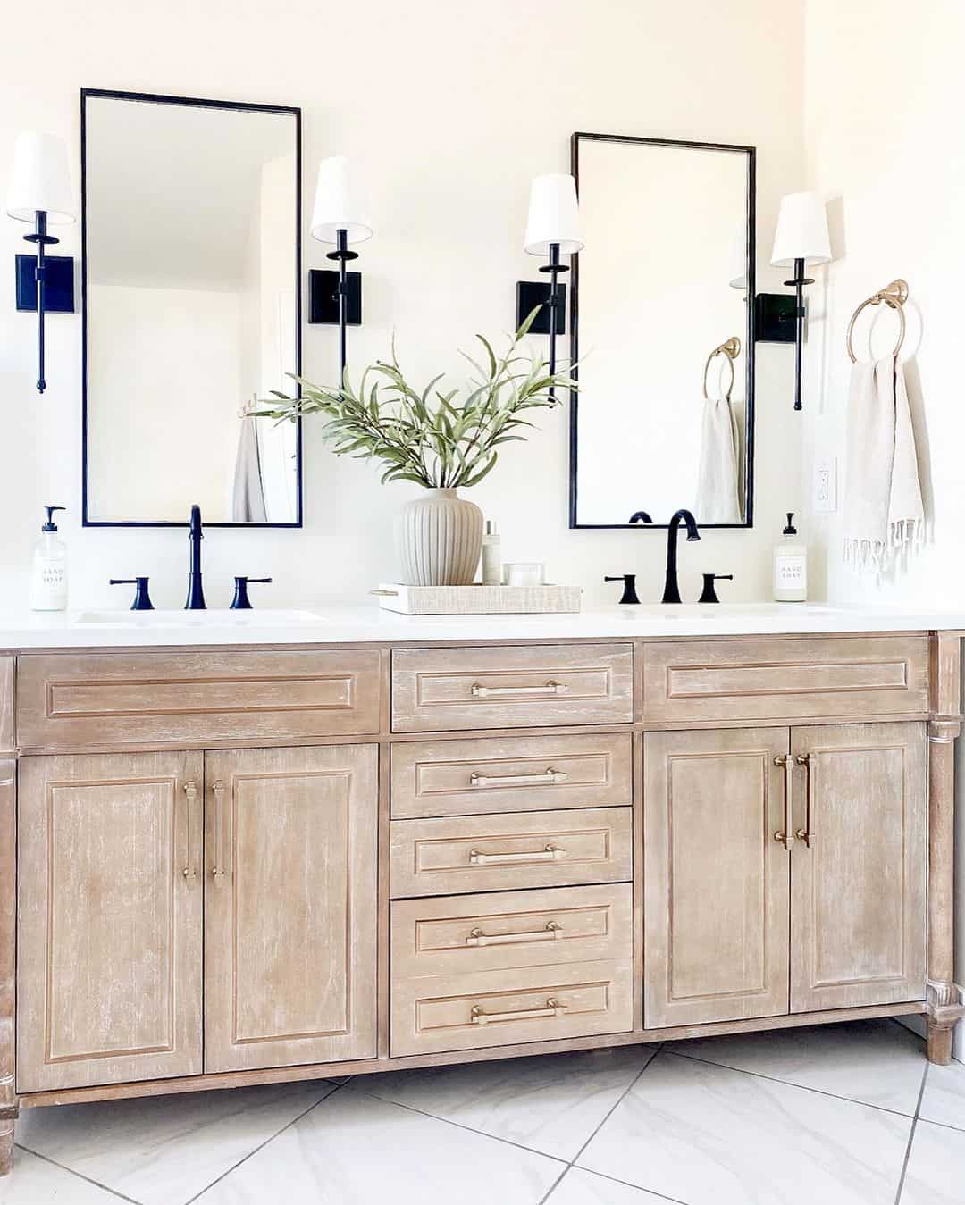 Thin Black Frames Above a Light Wood Vanity