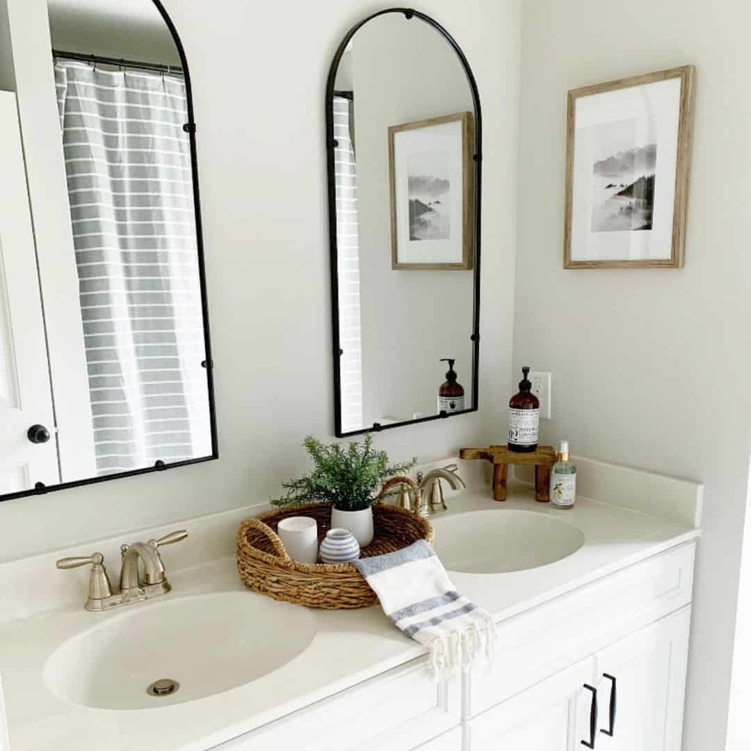 Arched Black Mirrors Frame a Serene Bathroom Vanity