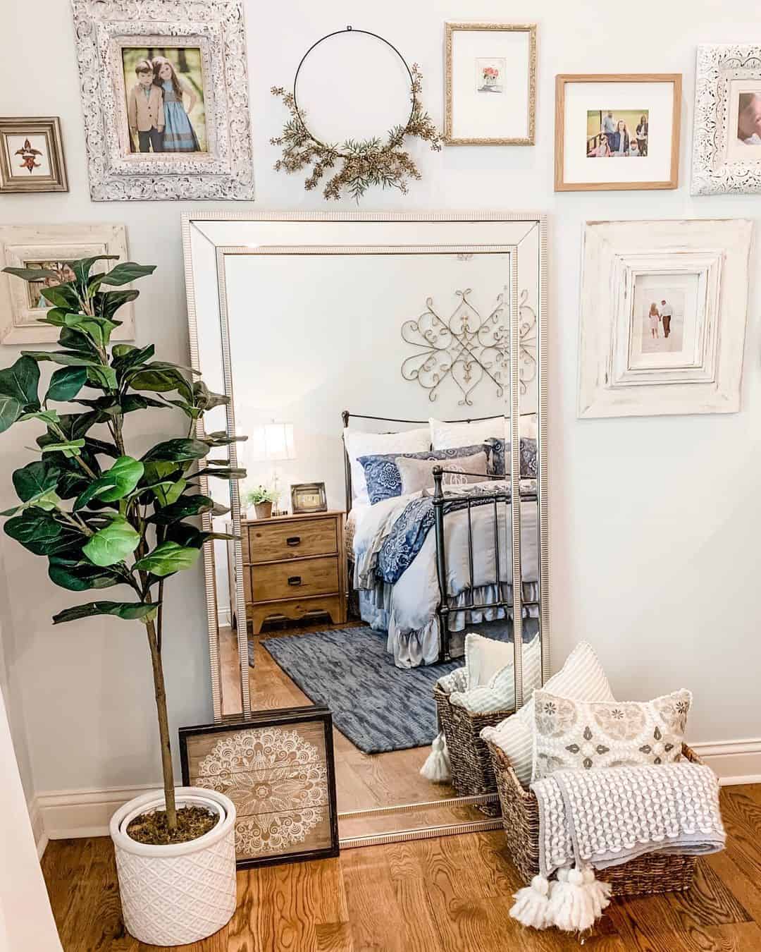Tall Beveled Mirror Reflects a Cozy Bedroom Vignette