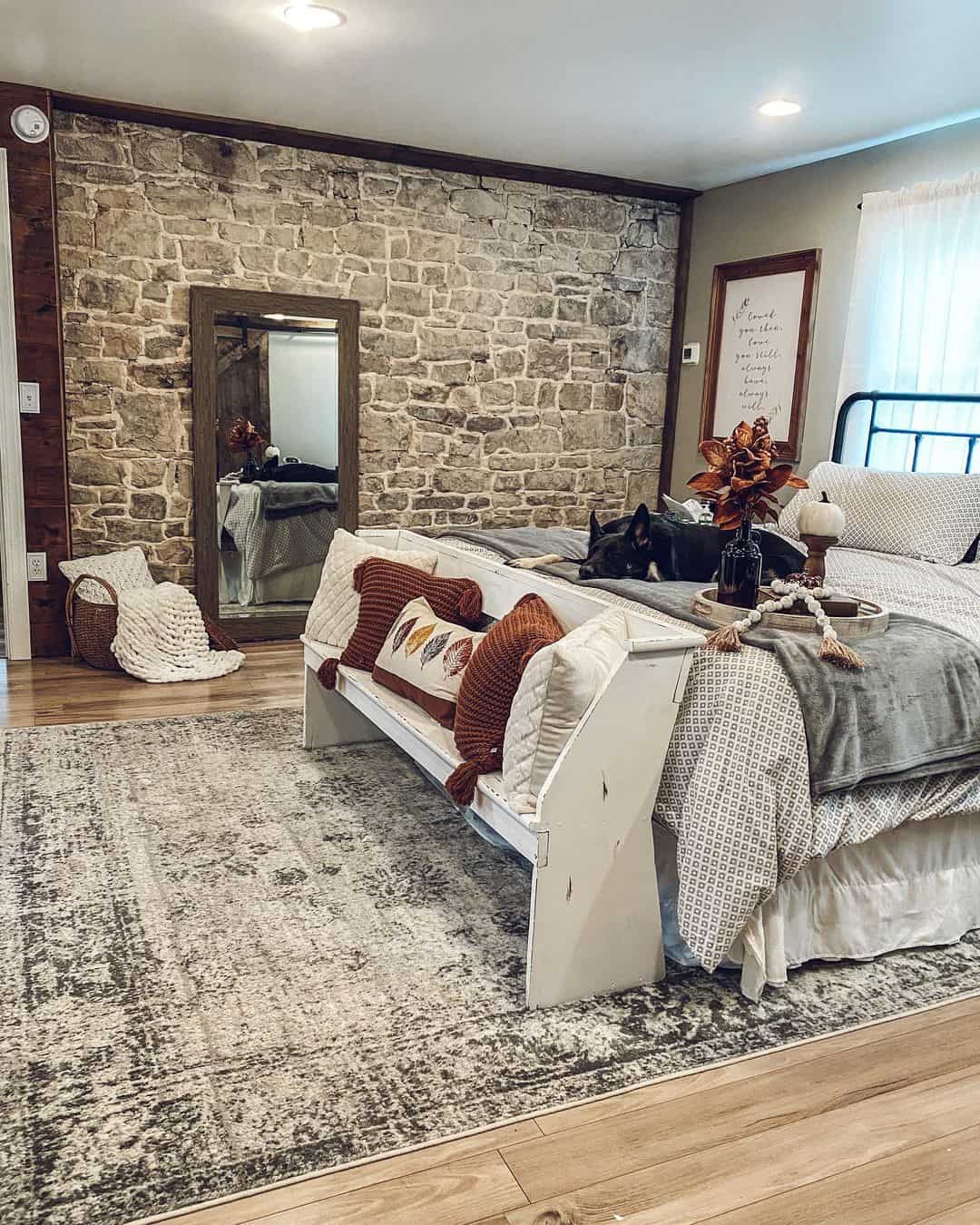 Tall Mirror with Dark Wood Frame Anchors a Stone Wall