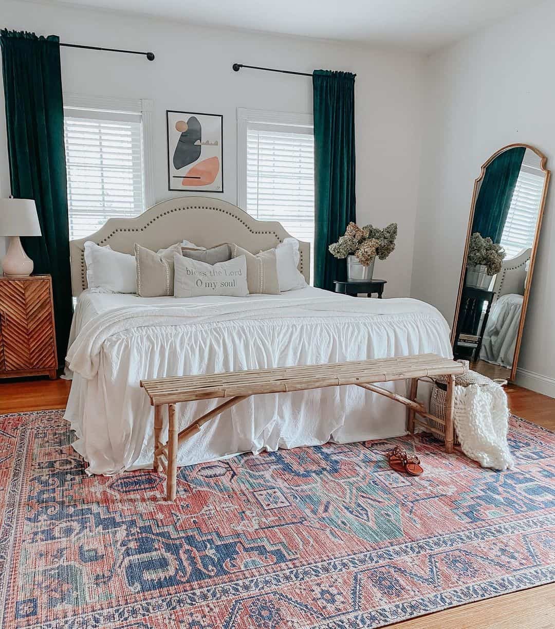 Tall Mirror with Ornate Gold Frame Leans Against Wall