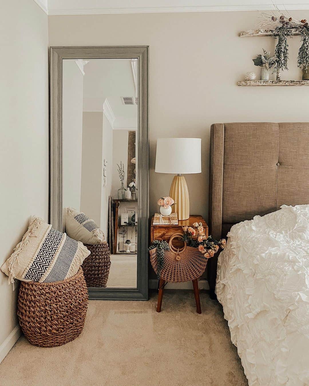 Tall Gray Mirror Frames a Cozy Corner with Textured Baskets