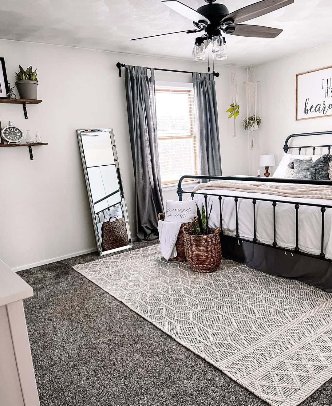 Tall Mirror Reflects Natural Light Near Bedside Basket