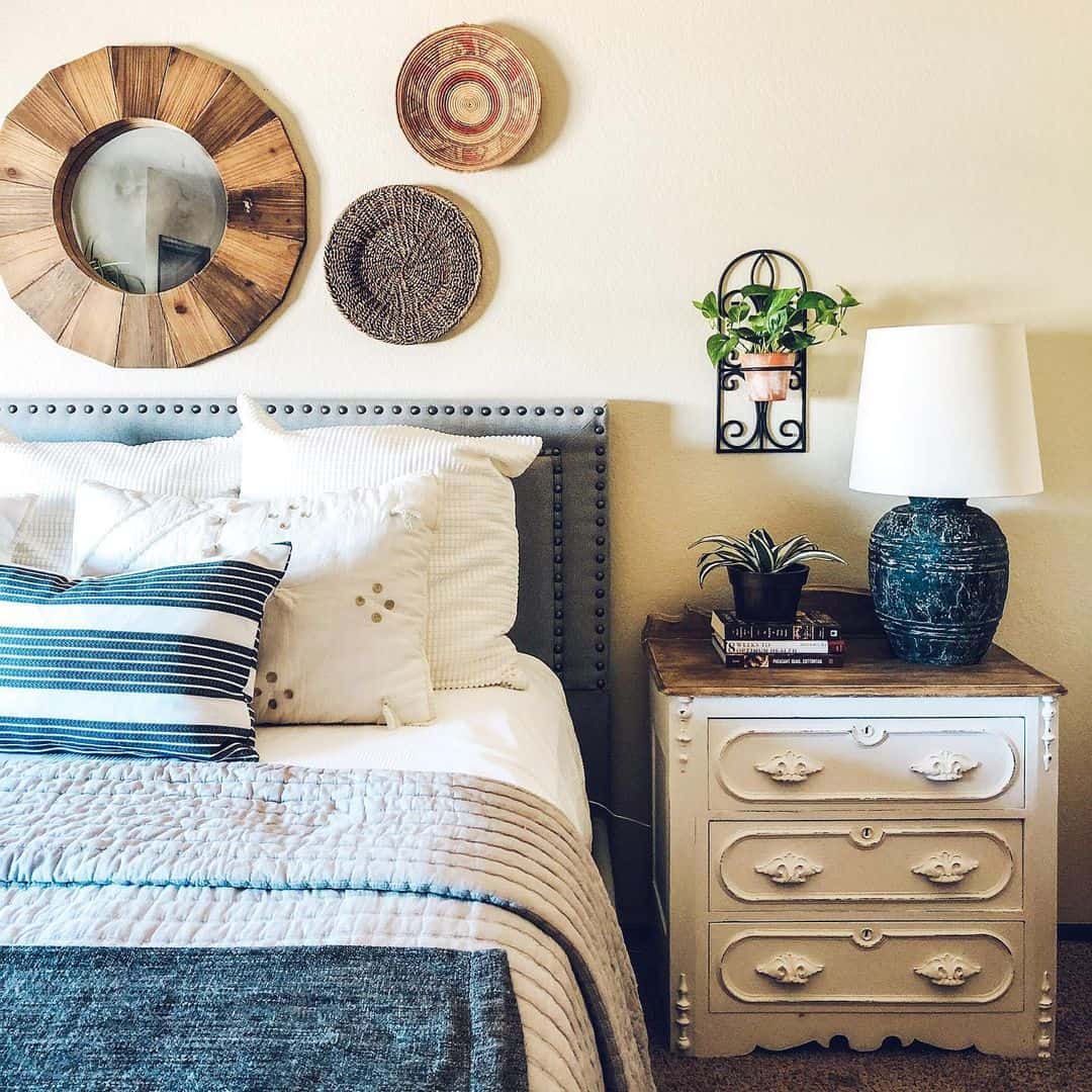 Round Wood Mirror Adds Natural Texture Above Tufted Headboard