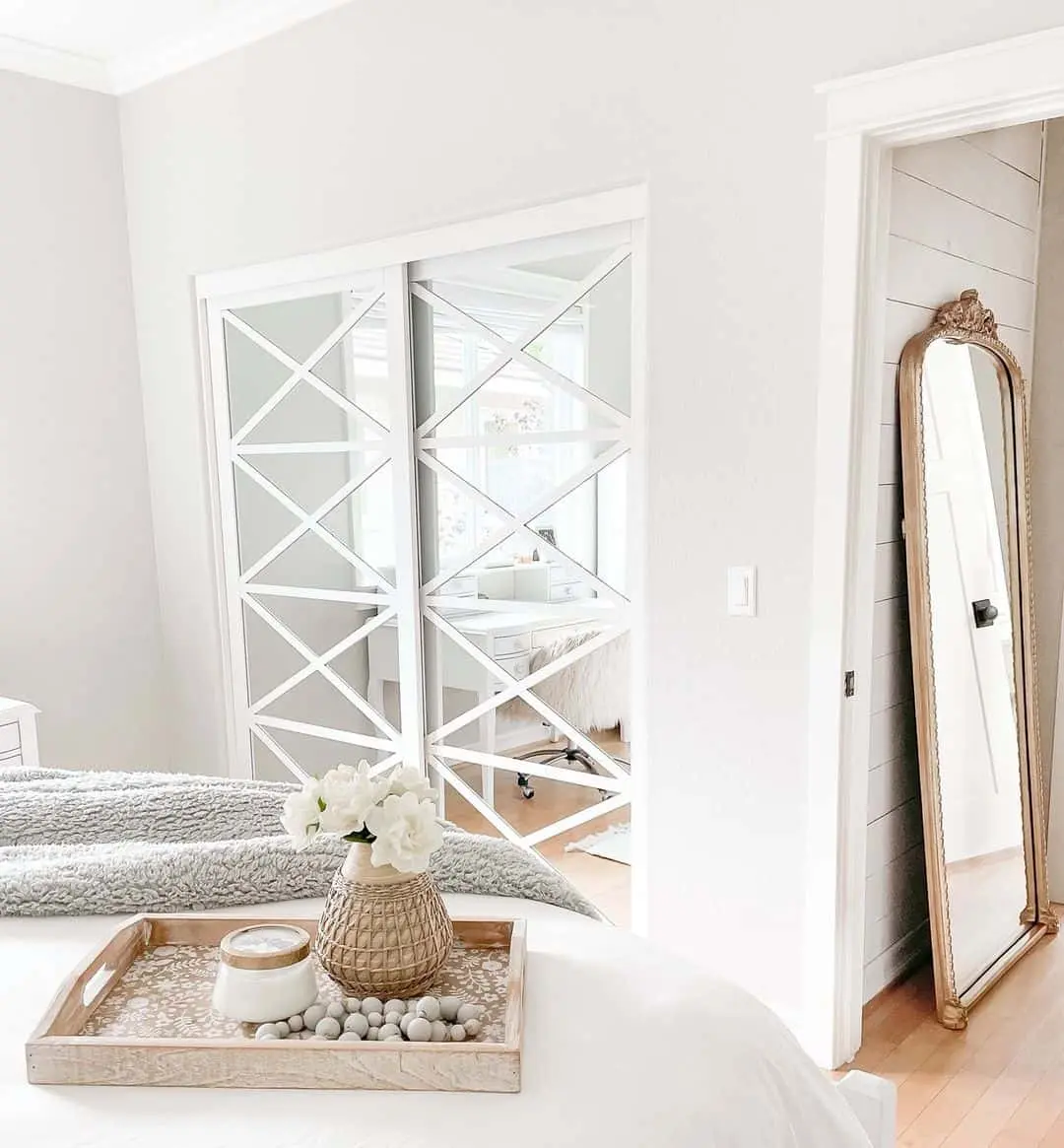 Mirrored Closet Doors With Geometric Overlay Add Depth