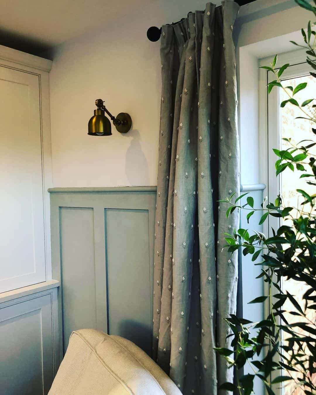 Subtle Dimension with Soft Blue-Gray Wainscoting