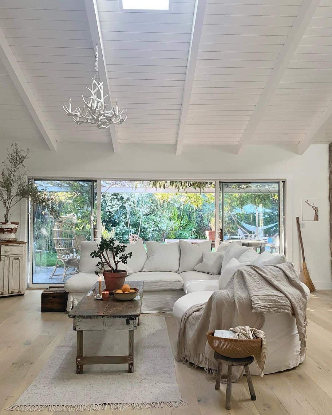 Incorporate a Whimsical Antler Chandelier for a Vaulted Ceiling