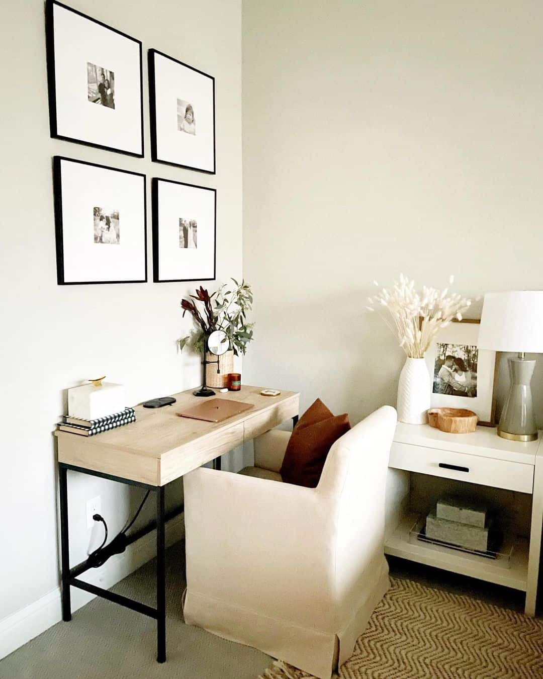 Four Black-Framed Photos Create A Gallery Wall Above Your Desk