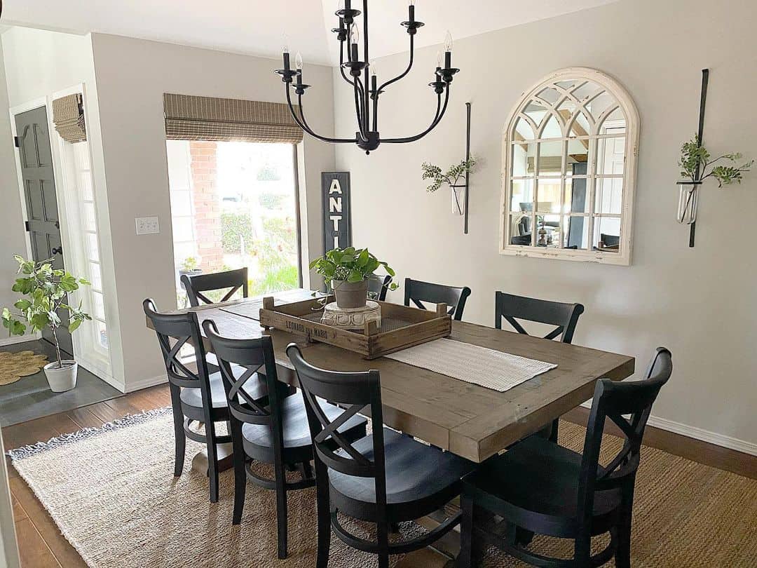 Arched Window Mirror Adds Architectural Interest Above the Table