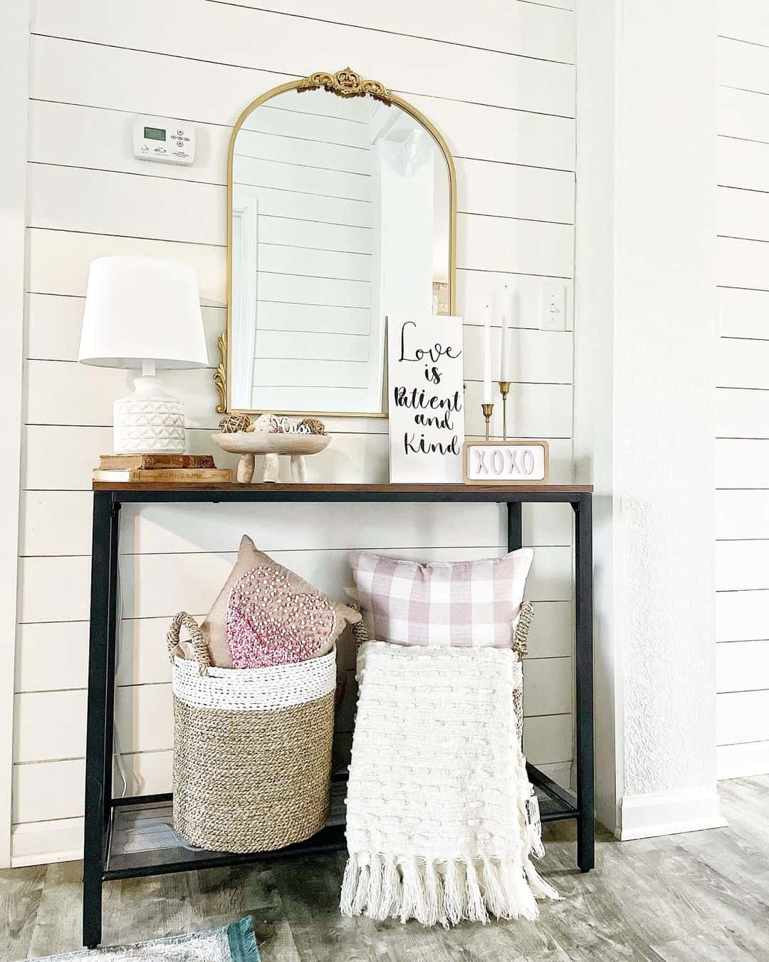 Layered textiles add cozy comfort below the console