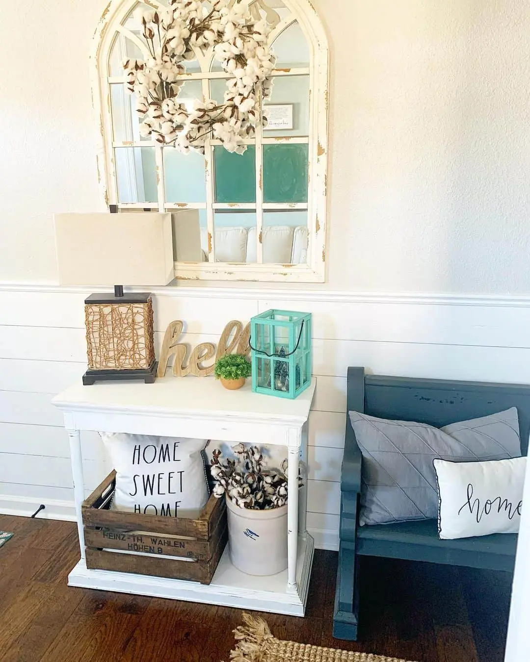 Wooden Crate Organizes Pillows and Cotton Stems