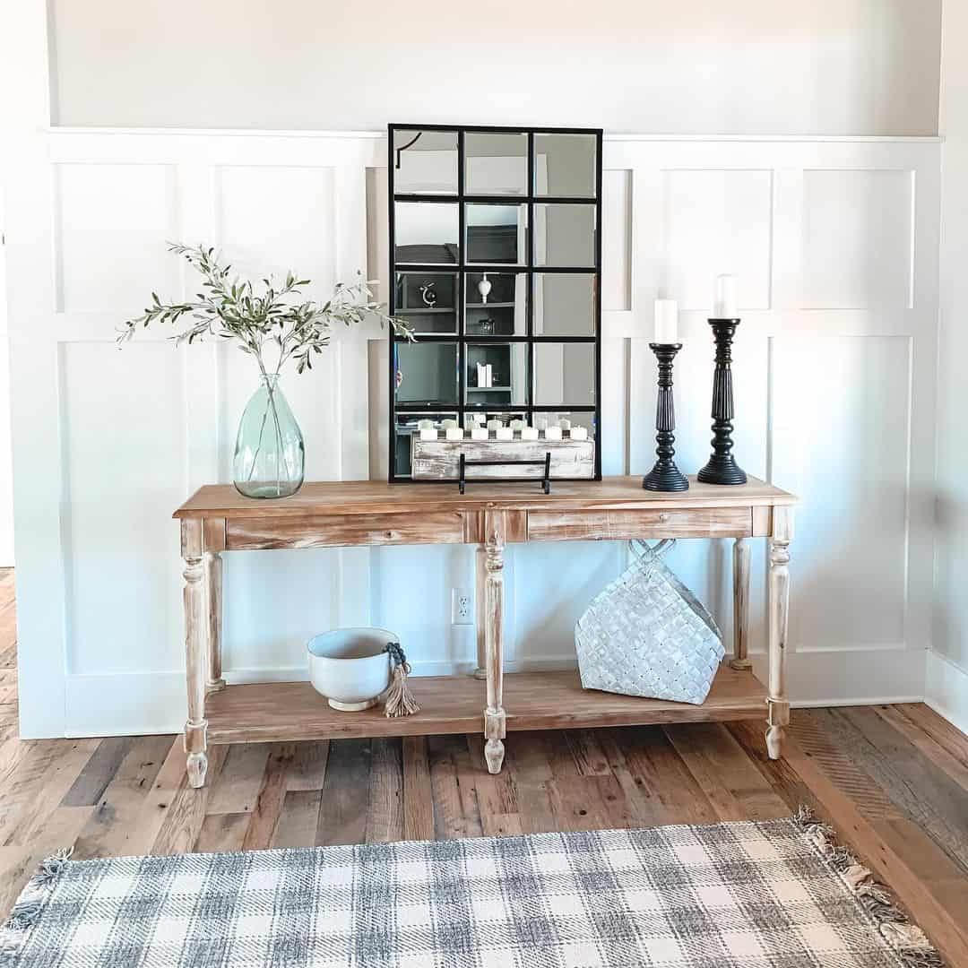 Windowpane Mirror Reflects Candlelight on Console Table