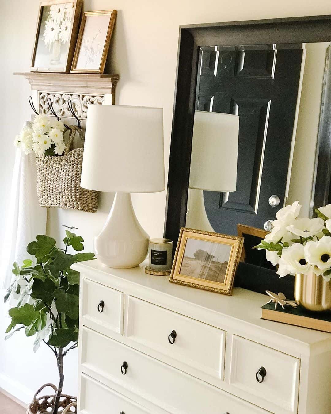 Layered Artwork Adds Dimension Above Entryway Console