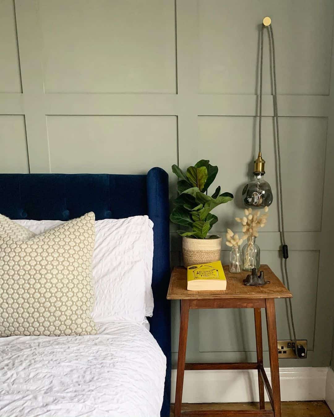 Green Board and Batten Walls With a Modern Pendant Light