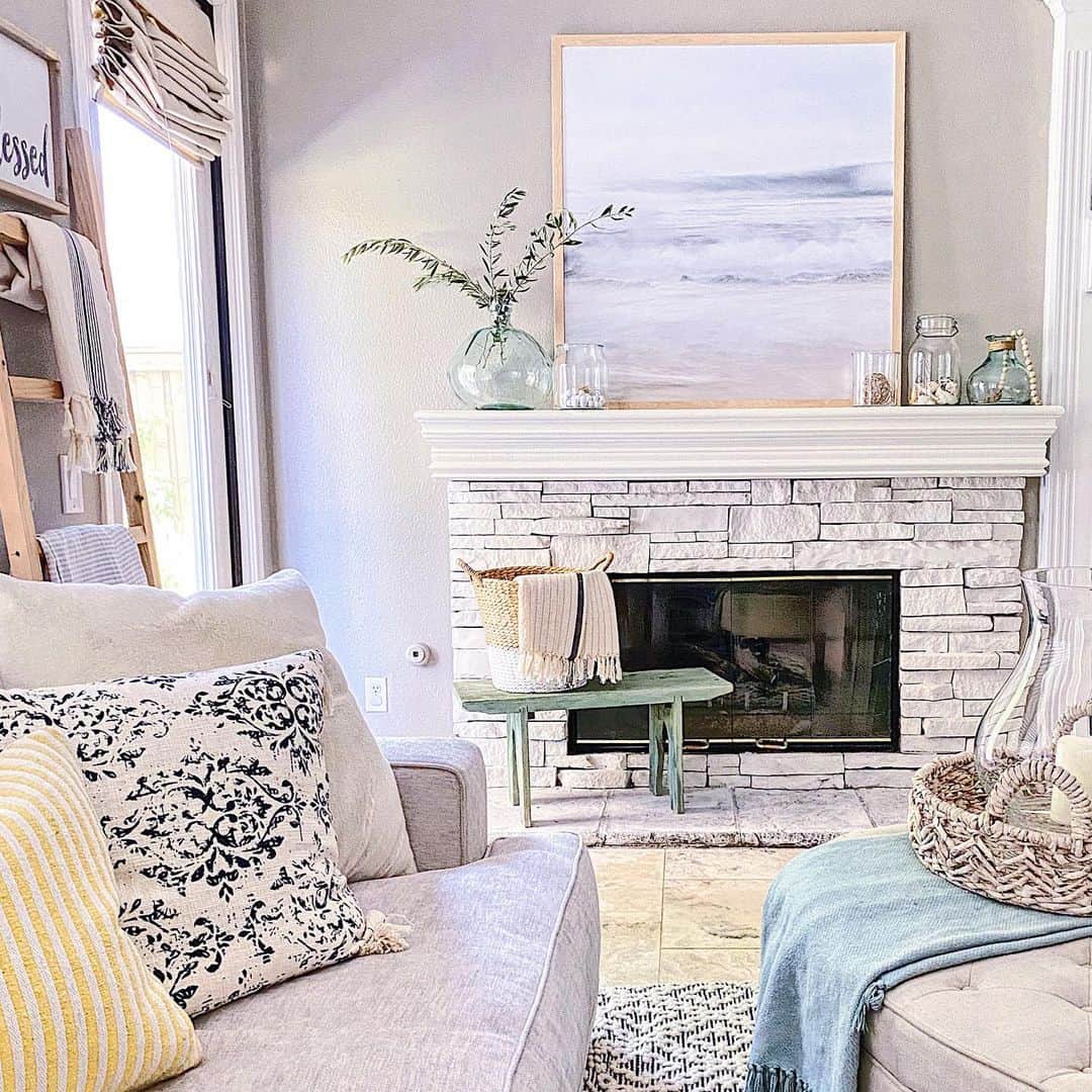 Style your stone fireplace mantel with coastal artwork