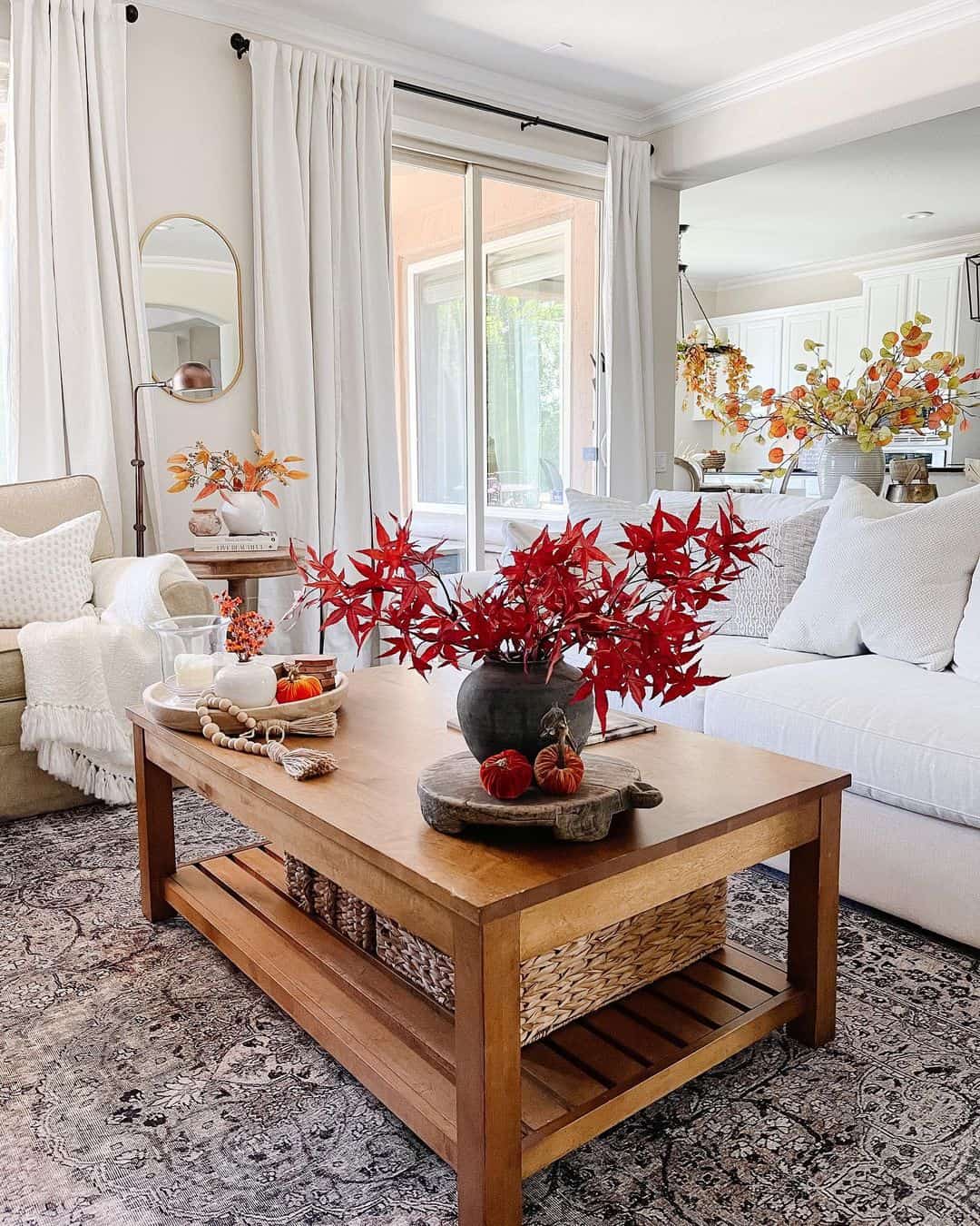 Bring bold autumn color with a dark vase of red maple leaves