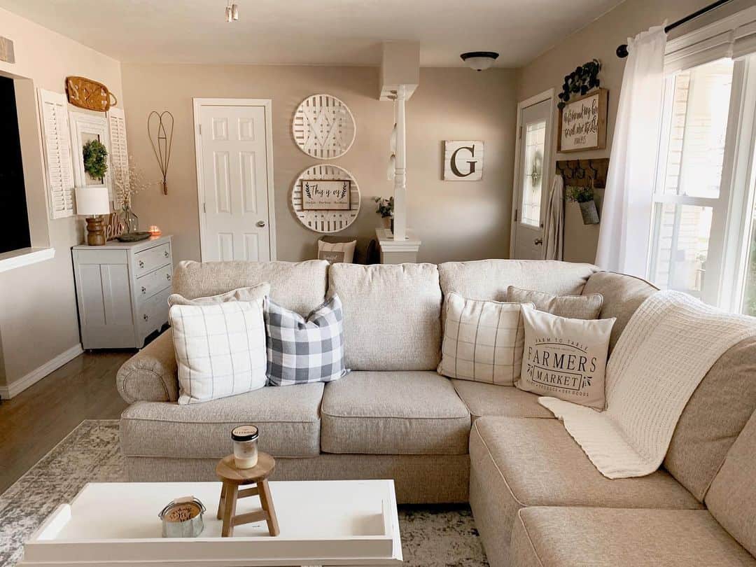 Gathering pillows with farmhouse graphics create a cozy feel