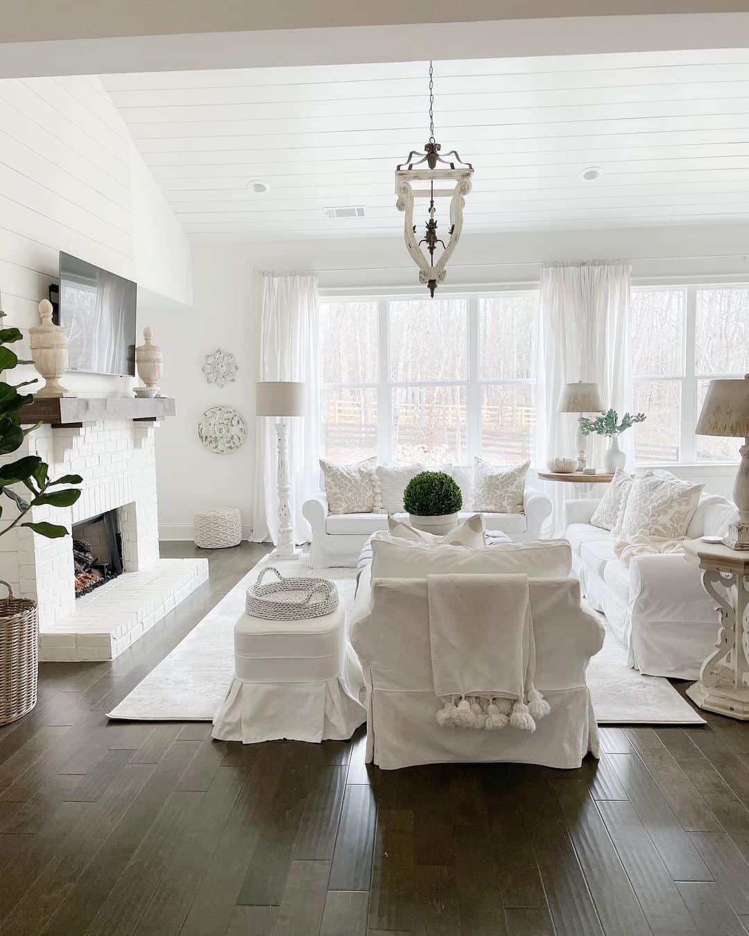White slipcovered furniture creates a serene, airy family room