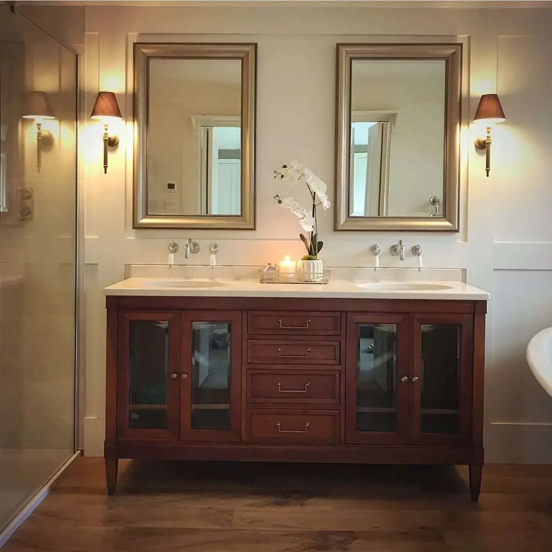 Showcase Linens and Decor in a Dark Wood Vanity with Glass Doors