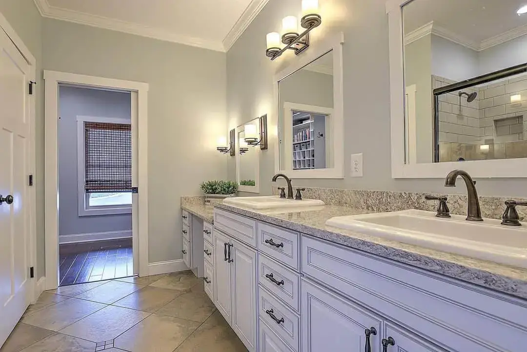 Achieve Classic Farmhouse Style with White Shaker Cabinets and Dark Hardware
