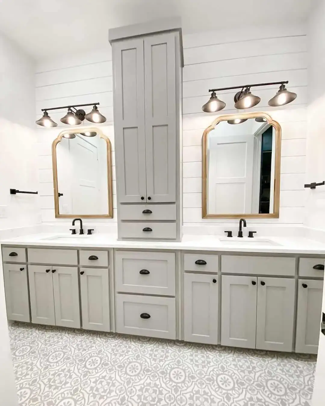 Tall Gray Cabinet Adds Vertical Storage Between Double Vanities