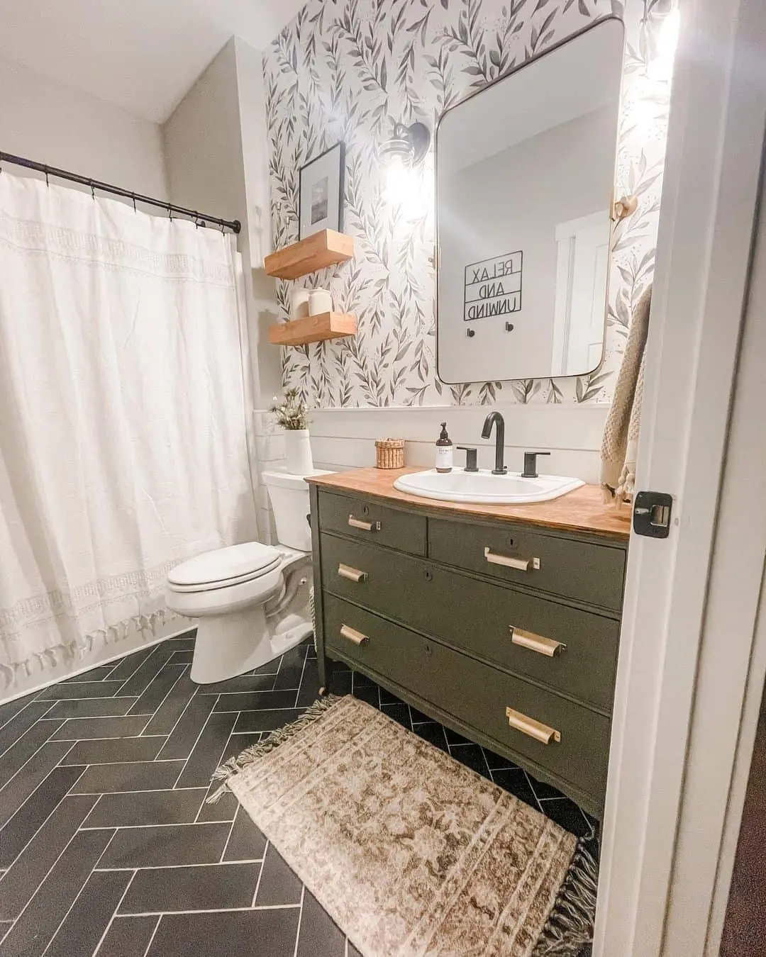Ground Your Farmhouse Bathroom with Dark Herringbone Tile Floors