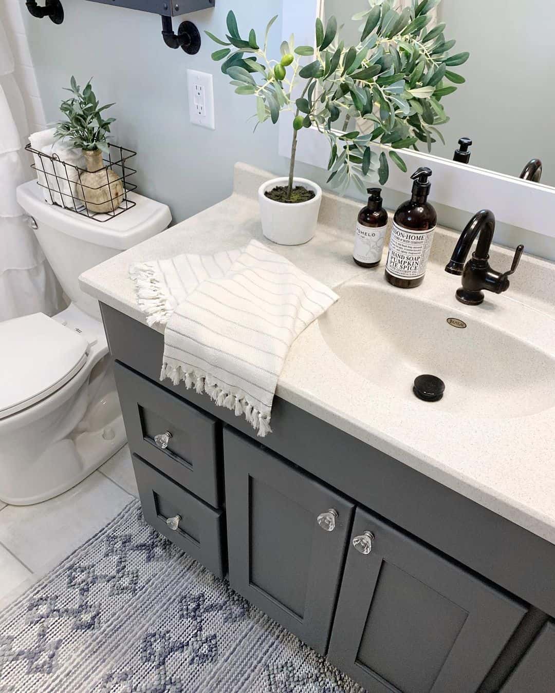 Clear Glass Knobs Add Sparkle to a Dark Vanity
