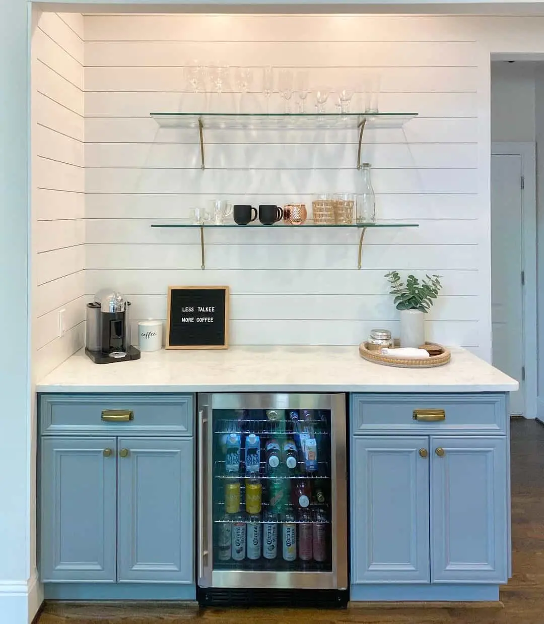 Pale Blue Cabinetry Frames a Built-In Beverage Refrigerator