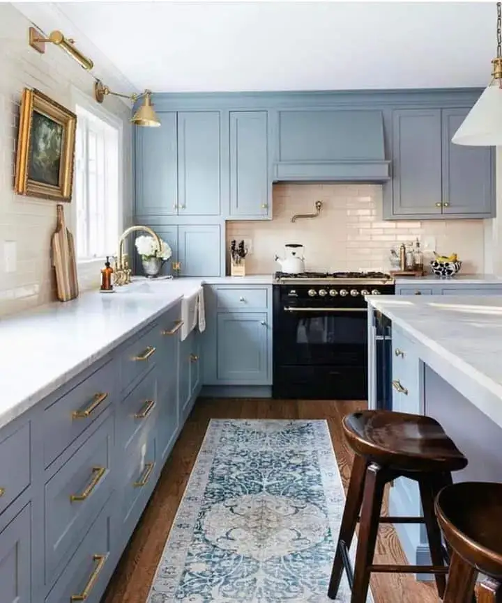 Pale Blue Shaker Cabinets With Rounded Brass Bar Pulls