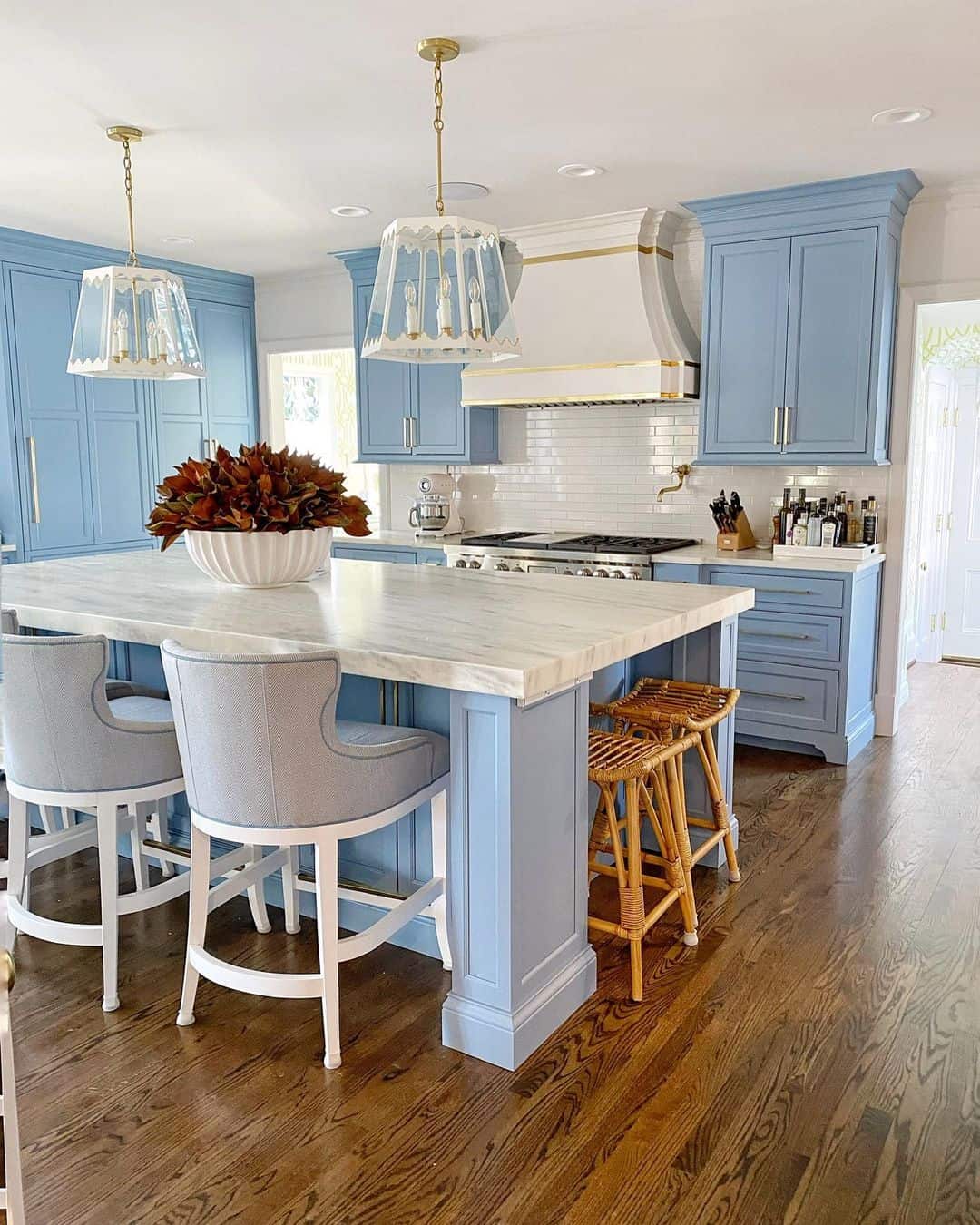 Pale Blue Island Base Anchors Marble Countertop and Seating