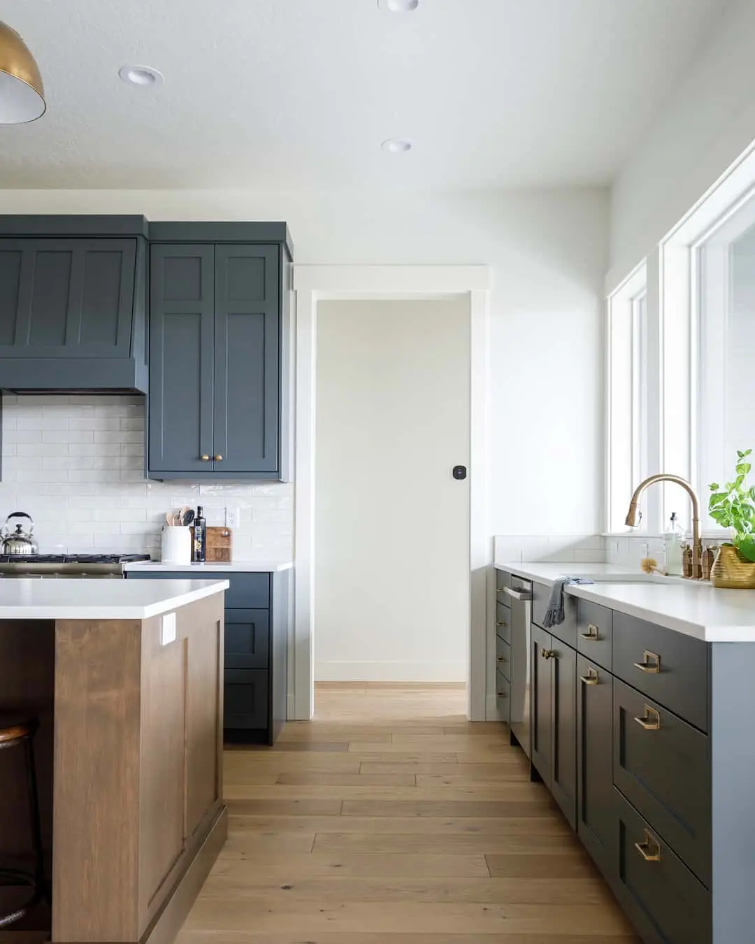 Dark Blue Shaker Cabinets With Warm Brass Hardware