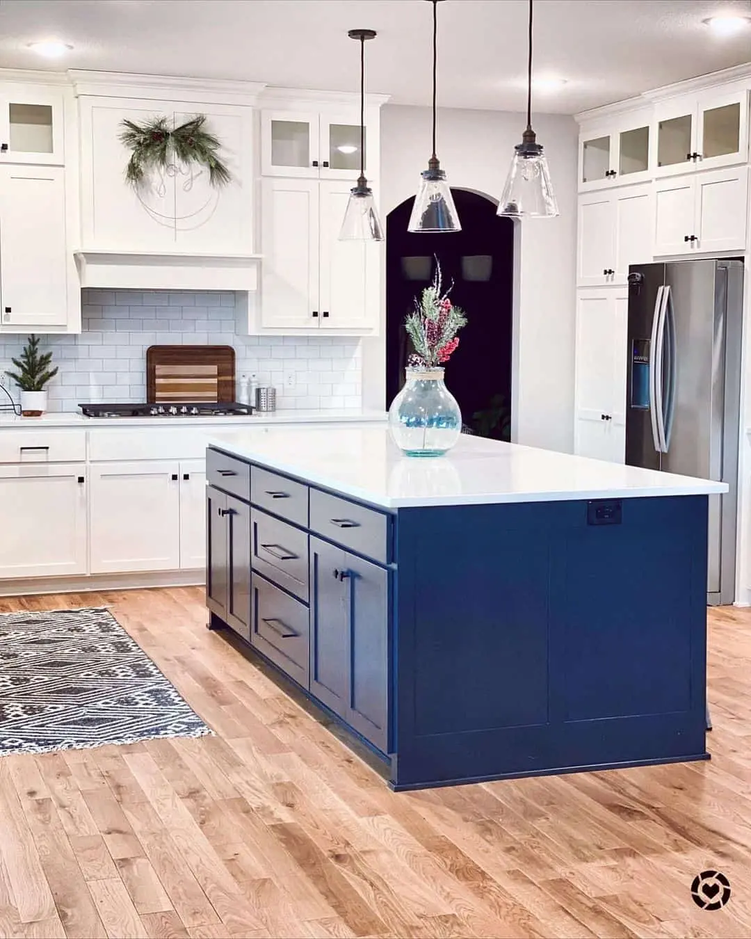 Deep Navy Island Cabinets With Simple Black Hardware