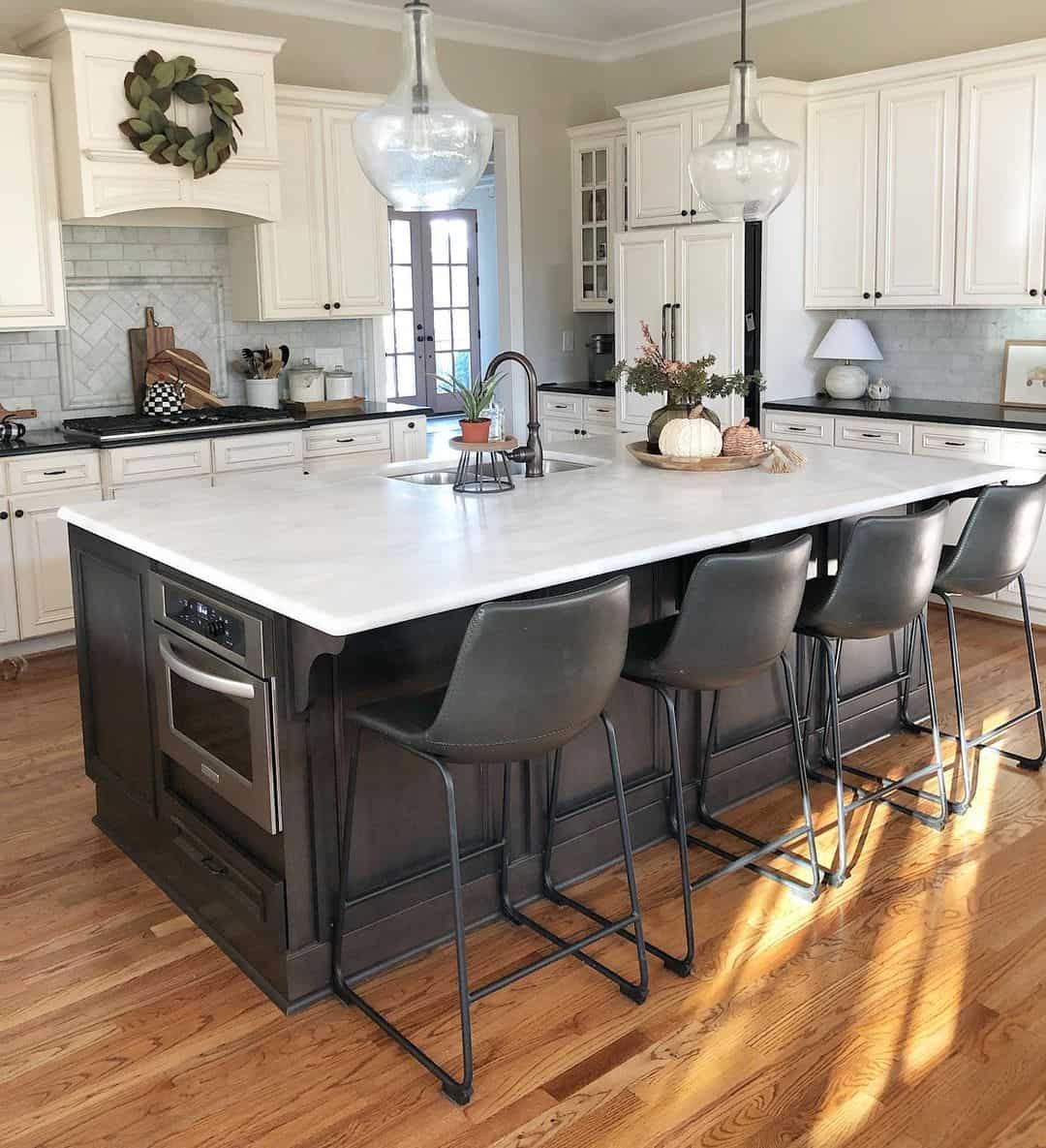 Dark Wood Island Base Grounds White Marble Countertop and Seating