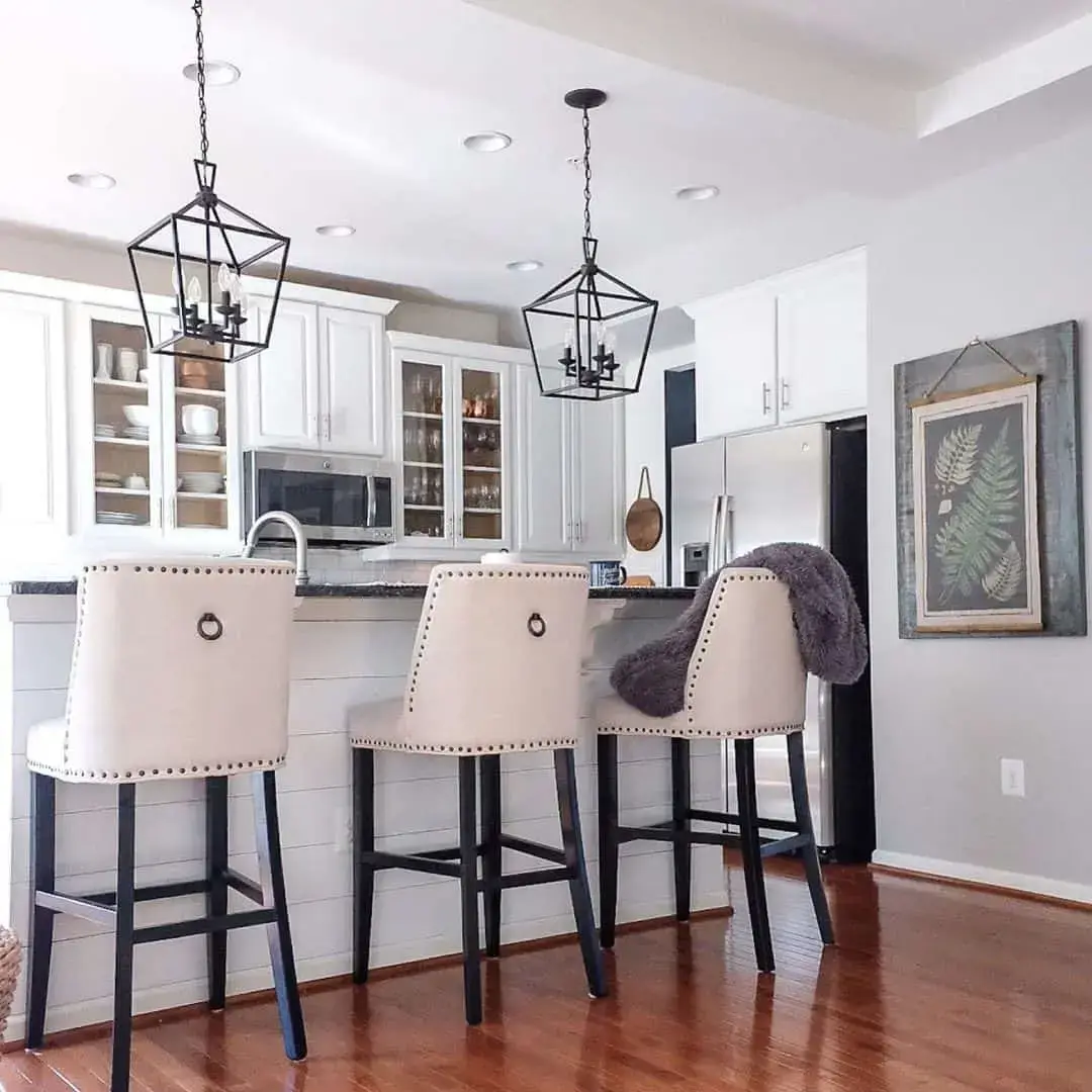Cream Upholstered Bar Stools With Ring Pulls Add Tailored Comfort