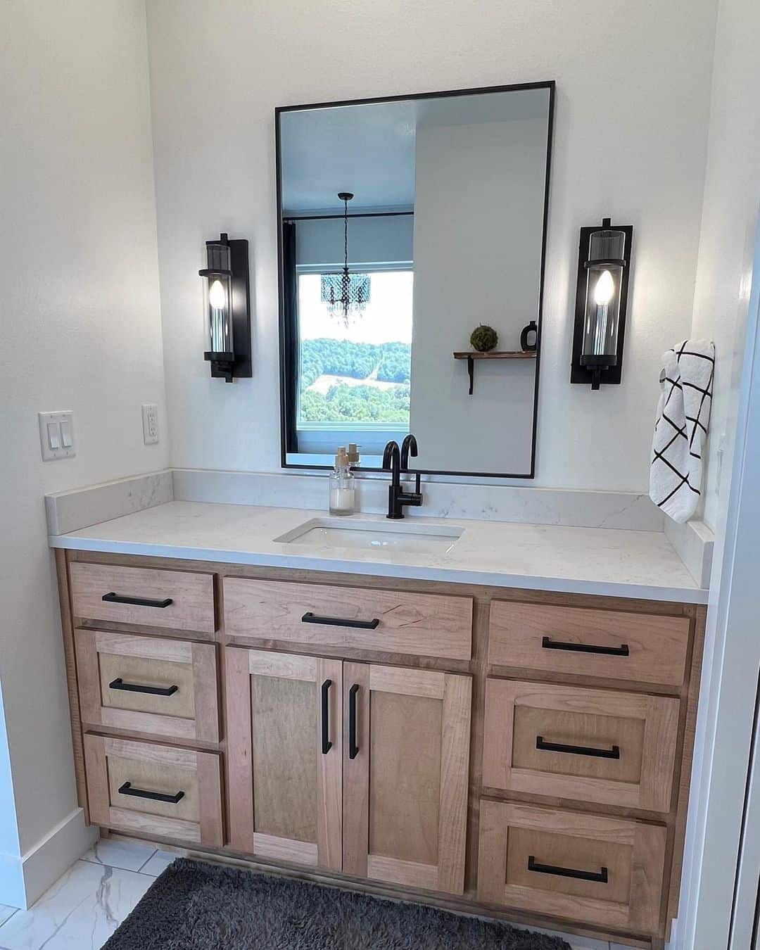 Tall Sconce Lights Add Vertical Interest Above the Vanity