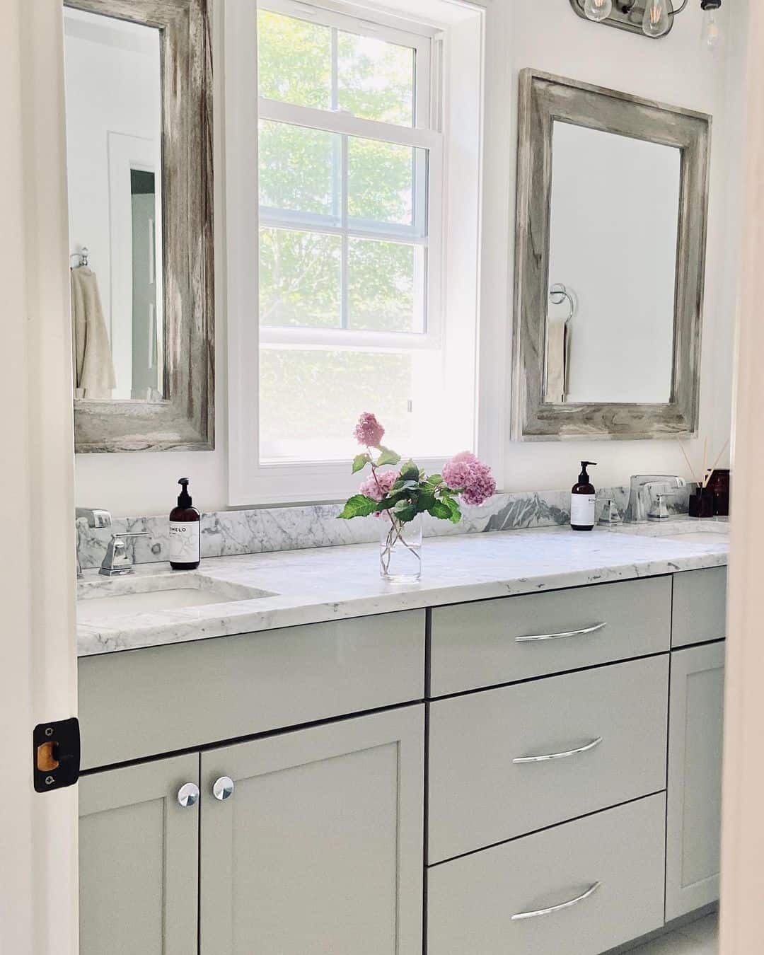 Distressed Wood Mirrors Frame a Serene Farmhouse Vanity