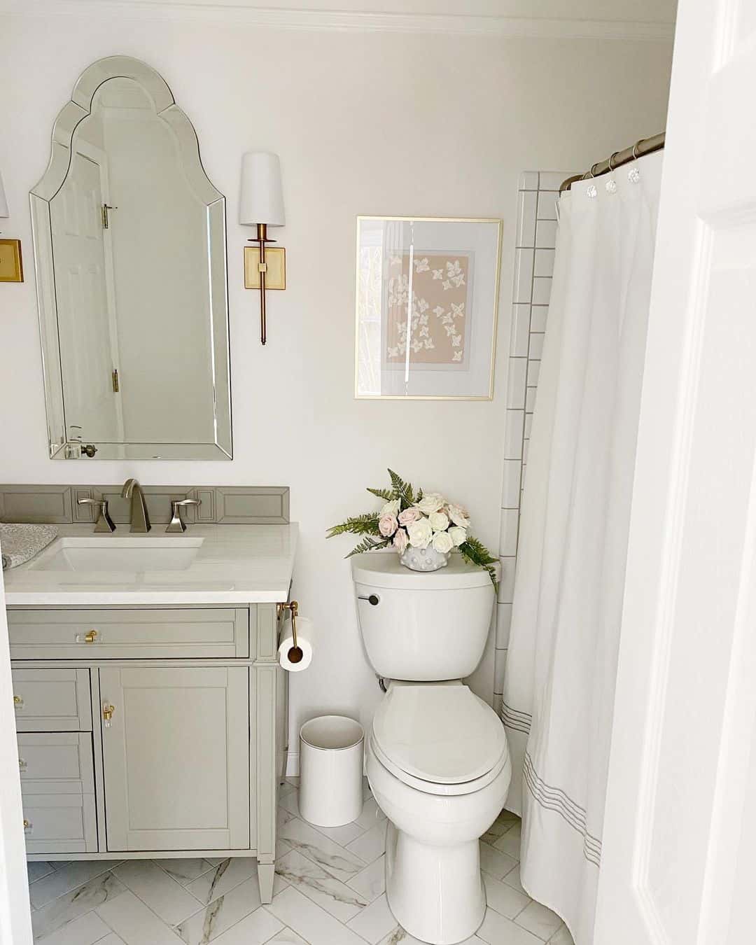 Framed Floral Art Adds a Soft Touch Above the Toilet