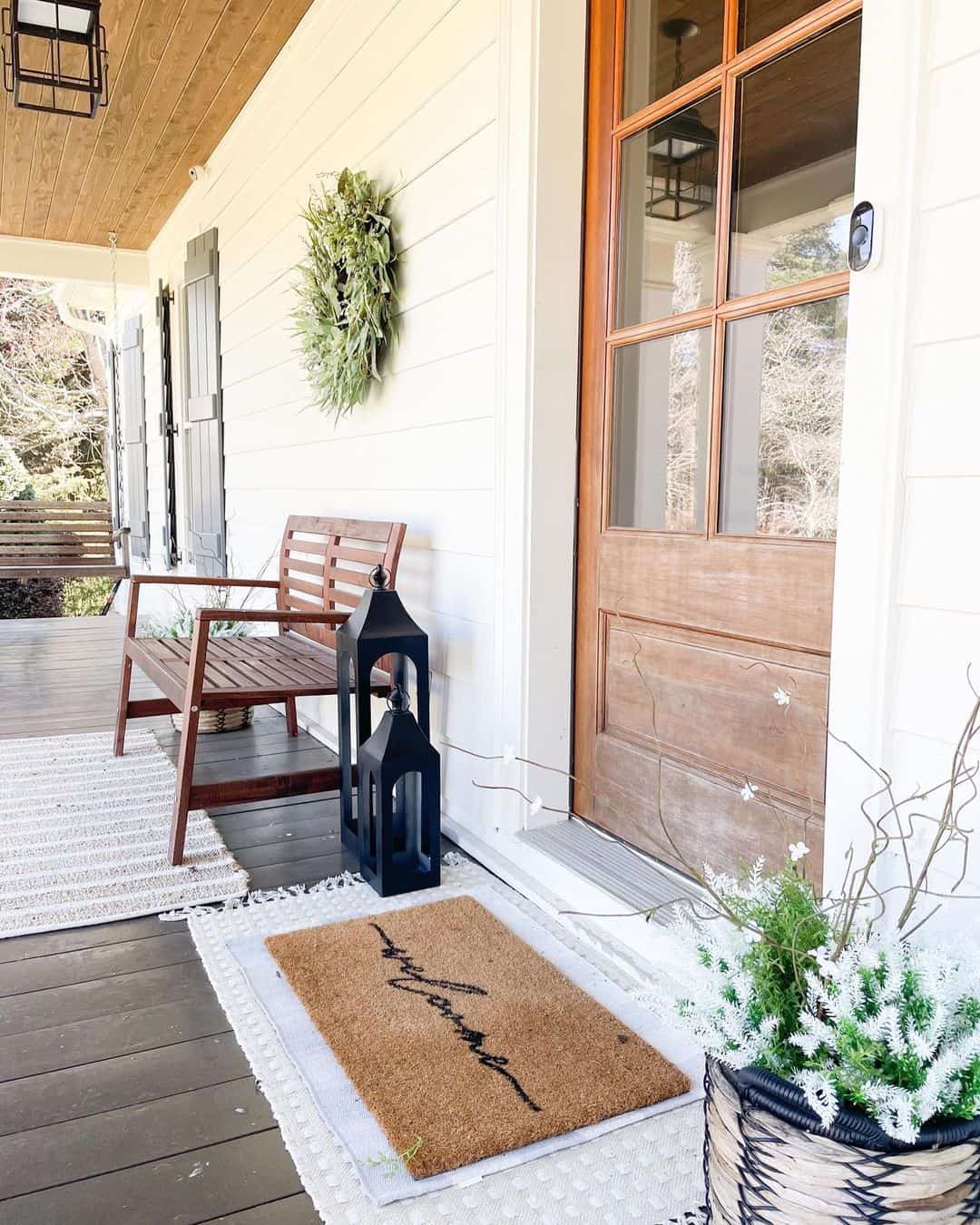 Flank Your Entryway with Black Lanterns and Layered Rugs