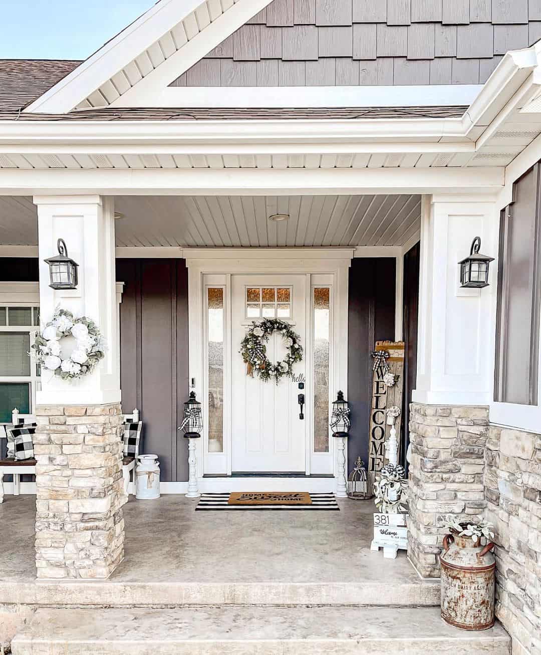 Soften Stone Pillars with White Floral Wreaths