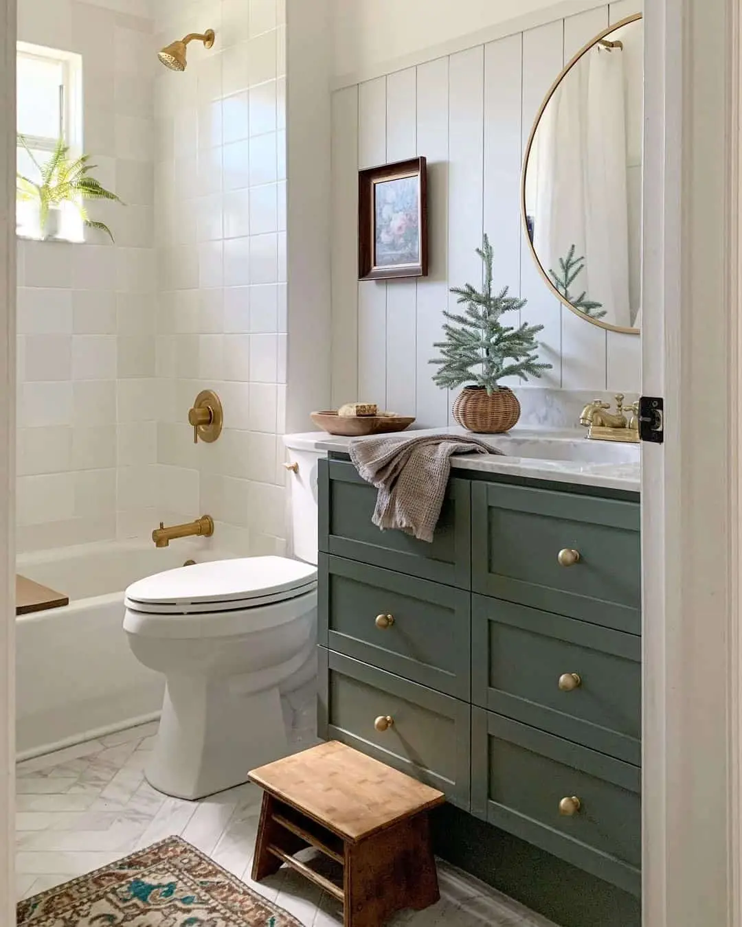 Green Vanity with Brass Hardware and Artwork