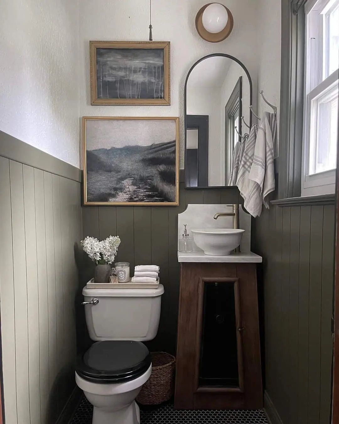 Two Moody Paintings Above Wainscoting